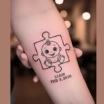 Baby puzzle piece tattoo symbolizing uniqueness, love, and the special connection between parent and child.